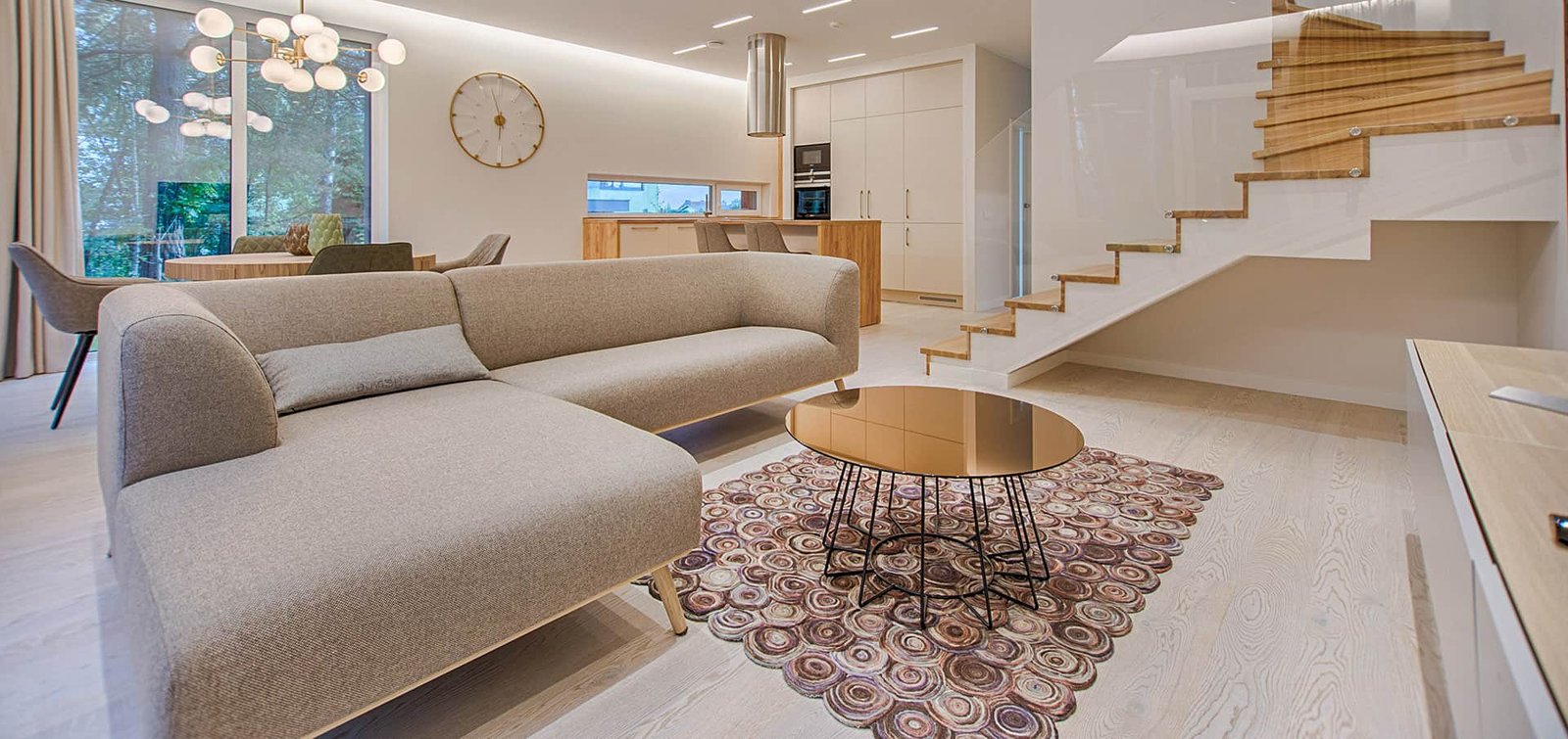 A calm living room with a neutral sofa
